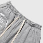 Close up view of the grey Hellstar Jupiter graphic terry shorts featuring an elasticated waistband and drawstring.