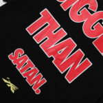 Close up of the Hellstar Knock Out T-shirt back graphic featuring the text Bigger Than Satan in bold red lettering