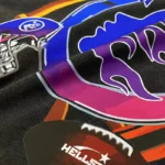 Close-up view of the vibrant Las Vegas graphic design on the front of a premium black Hellstar streetwear T-shirt.