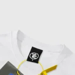 Close-up view of the white Hellstar Life Print T-Shirt neck label detail showing the brand logo and small size tag.