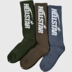 Three pairs of Hellstar logo socks in earthy tones featuring olive, brown, and blue colors with embroidered branding.