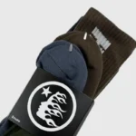 A pack of three Hellstar logo socks in versatile earth tones featuring a branded paper sleeve and comfortable cotton.
