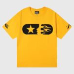 Hellstar Marathon yellow cotton unisex T-shirt featuring bold black star and flame graphic, vintage washed screen print