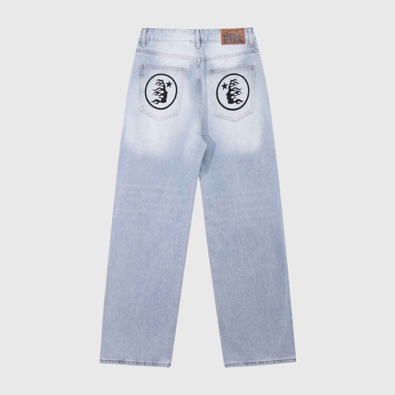 Hellstar men's light blue graphic denim jeans featuring circular logos on the back pockets and signature branding.