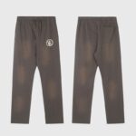 Front and back view of brown Hellstar Mirror Faced sweatpants with a graphic logo and drawstring closure.