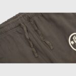 Brown Hellstar Mirror Faced sweatpants featuring a comfortable elastic waistband with an adjustable drawstring detail.