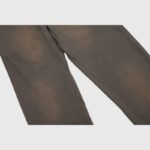 Close-up view of the premium brown fabric texture on the Hellstar Mirror Faced streetwear sweatpants