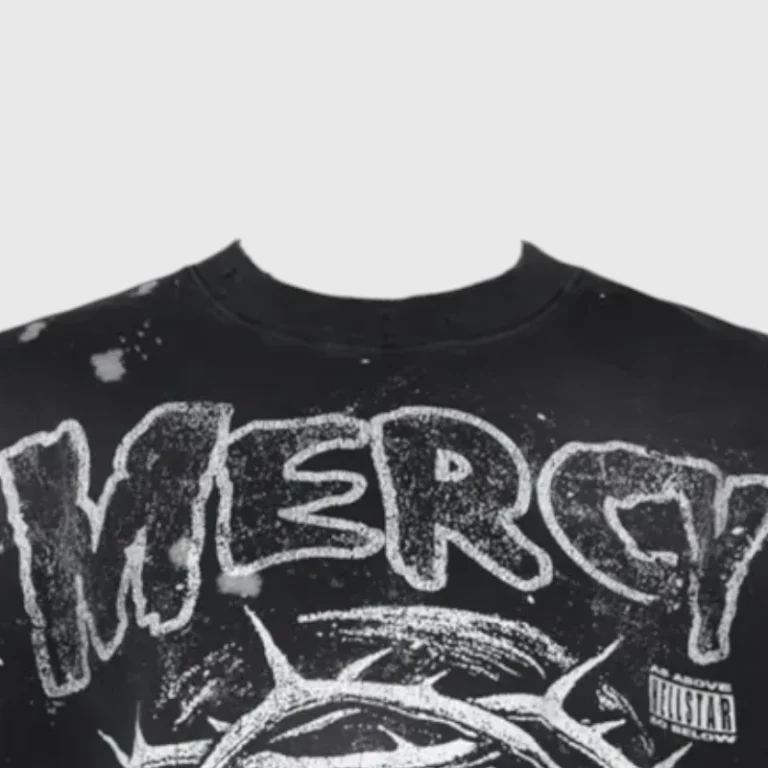 Close up view of the front graphic on the black Hellstar Misfits Mercy T-Shirt featuring distressed text and crown