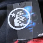 Hellstar Motion Blur Tracksuit brand tag featuring the iconic flame star logo and Path to Paradise graphic print.