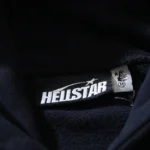 Close-up view of the branded internal neck tag on the Hellstar Motion Blur black cotton tracksuit hoodie.