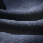 Close-up view of the premium black cotton fabric used in the high-quality Hellstar Motion Blur streetwear tracksuit.