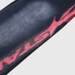 Detail of the Hellstar Motion Blur tracksuit featuring a signature red graphic design on washed black cotton fabric.