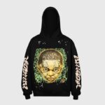 Front view of the Hellstar New Testament hoodie featuring a unique graphic and bold sleeve branding in black fleece.