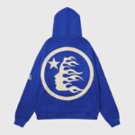 Back view of the Hellstar No Guts No Glory blue hoodie featuring a circular graphic with a flaming face and star.