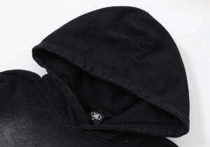 A detailed close-up shot of the black Hellstar No Guts No Glory tracksuit hoodie featuring the internal brand tag.
