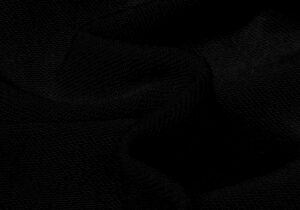 Close-up view of the premium washed black cotton fabric used for the Hellstar No Guts No Glory streetwear hoodie.
