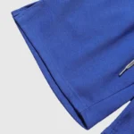 Close-up view of the vintage royal blue fleece fabric texture of the Hellstar No Guts No Glory shorts design.