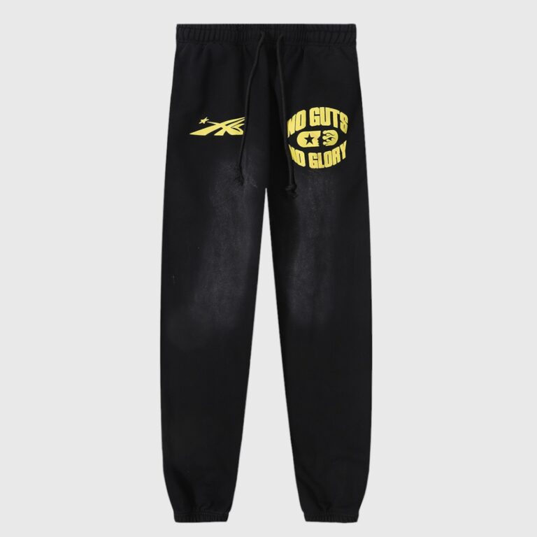 Black Hellstar No Guts No Glory sweatpants featuring yellow screen-printed graphics and fleece fabric.