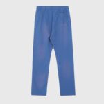 Back view of the blue Hellstar No Guts No Glory sweatpants with a vintage wash and single rear patch pocket.