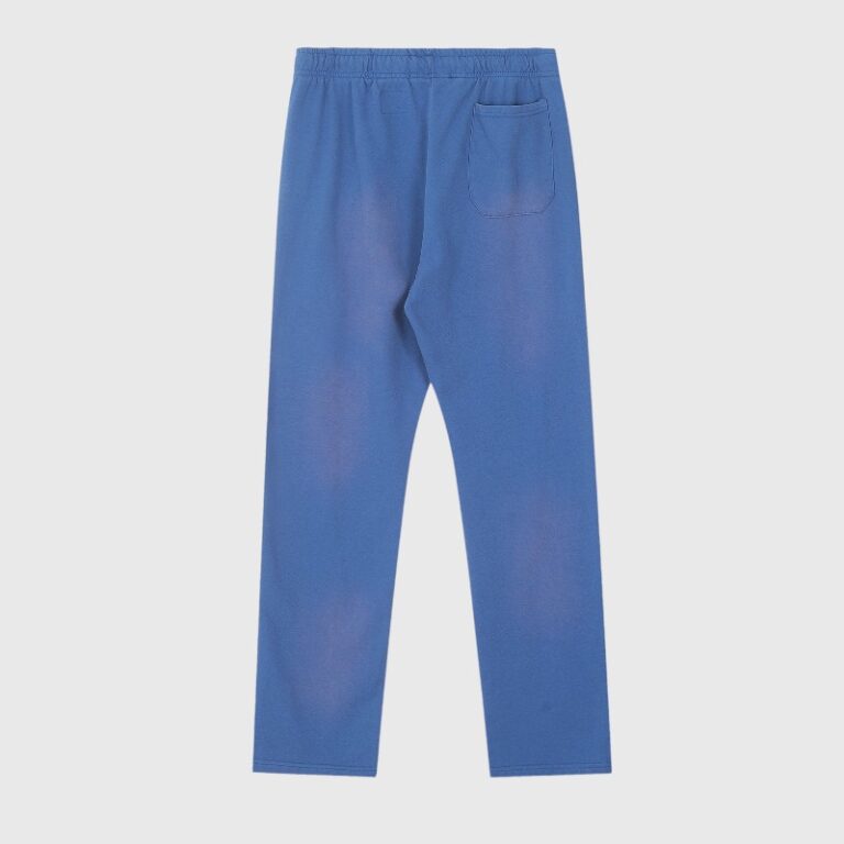 Back view of the blue Hellstar No Guts No Glory sweatpants with a vintage wash and single rear patch pocket.