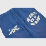 Hellstar No Guts No Glory sweatpants in blue with vintage wash, drawstring waist, and iconic screen-printed graphics.