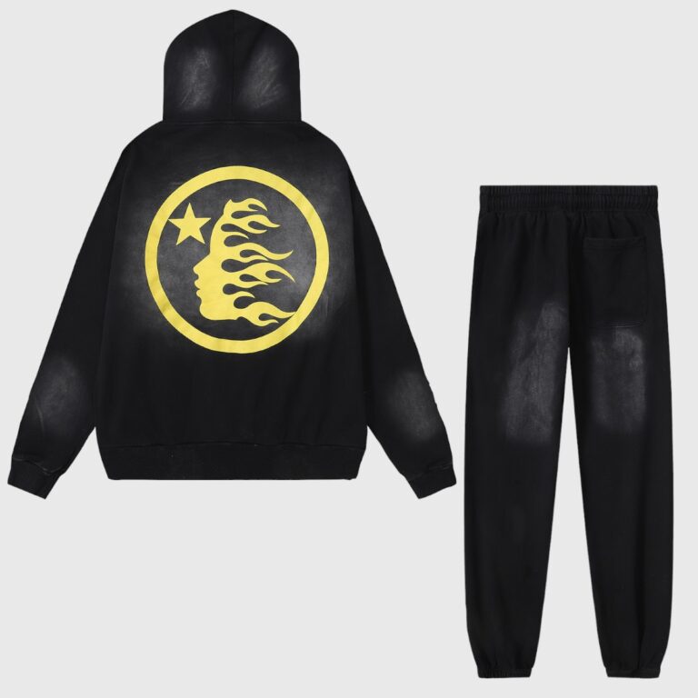 Hellstar No Guts No Glory Tracksuit in Black featuring a yellow graphic flame face logo on the back of the hoodie.