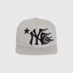 Hellstar NY Snapback Hat in grey featuring an iconic urban logo graphic with a star and flame design, adjustable fit.