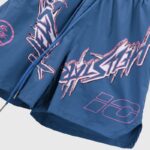 Light blue Hellstar nylon athletic shorts featuring bold graphic screen print designs and drawstring closure details.