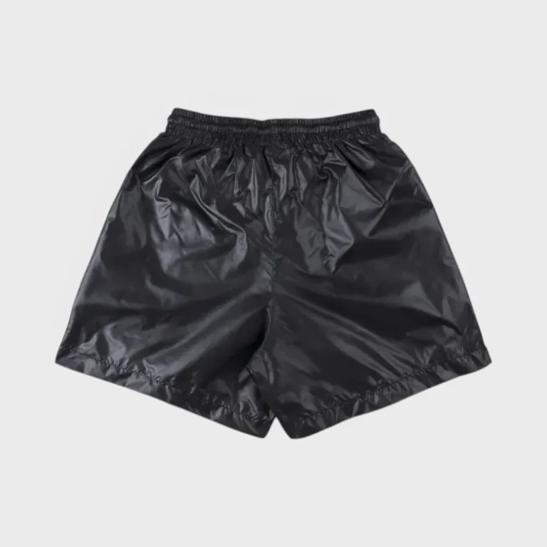 A back view of black Hellstar nylon shorts showcasing the elastic waistband and lightweight fabric material.
