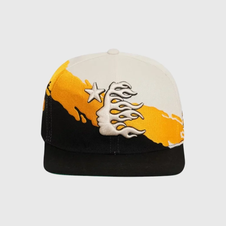Hellstar Paintbrush Snapback Hat in yellow and black, featuring a bold streetwear logo on a premium cotton cap.