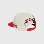 Hellstar Paintbrush Snapback Hat in Black and Red with embroidered artistic graphics and an adjustable snapback closure.