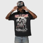 Man wearing a black Hellstar Paradise Girls graphic cotton t-shirt with a vintage aesthetic design and crew neck fit.