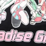 Detailed graphic print on the black Hellstar Paradise Girls T-shirt featuring a stylized anime character design.