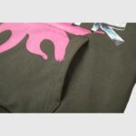 Close-up view of the premium fleece fabric texture and pink screen print detail on the Hellstar Path To Paradise Hoodie.