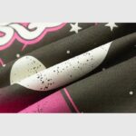 Close up of the Hellstar Path To Paradise hoodie showing the graphic design, pink accents, and star print details.
