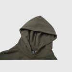 Close-up view of the drawstring hood on the olive green Hellstar Path To Paradise premium streetwear hoodie.