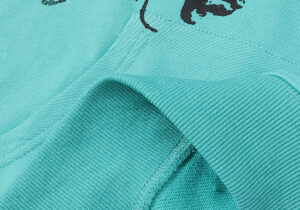 Close-up view of the premium mint green cotton fabric and black graphic print on the Hellstar Path to Paradise hoodie.