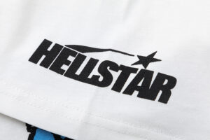 Close-up view of the black Hellstar logo printed on a white Pixel T-shirt, highlighting the fabric texture and brand detail.