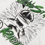 Close-up view of the Hellstar Racing T-shirt graphic featuring a distressed green logo and racing helmet design.