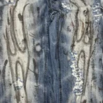 Detailed graphic print on Hellstar Raw Edge Jeans, featuring premium vintage washed denim for a stylish streetwear look.