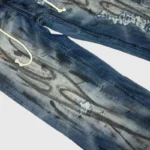 Vintage washed Hellstar Raw Edge Jeans featuring distressed graphic details and a comfortable denim fit