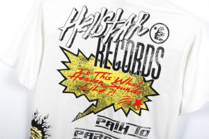 Detailed back view of the white Hellstar Records Crazy T-shirt featuring a bold graphic print with yellow starburst.
