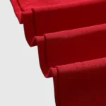 Close up view of the premium red cotton fabric of the Hellstar Records T-Shirt featuring a vintage washed effect
