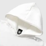 Close-up view of the Hellstar Records white hoodie featuring the interior neck tag detail and premium fleece fabric.