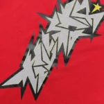 Close-up of the red Hellstar crack print T-shirt featuring a detailed distressed graphic design on soft cotton fabric.