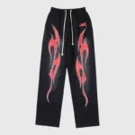 Hellstar Red Flame Sweatpants featuring a black vintage washed cotton base with bold airbrushed red flame graphics.