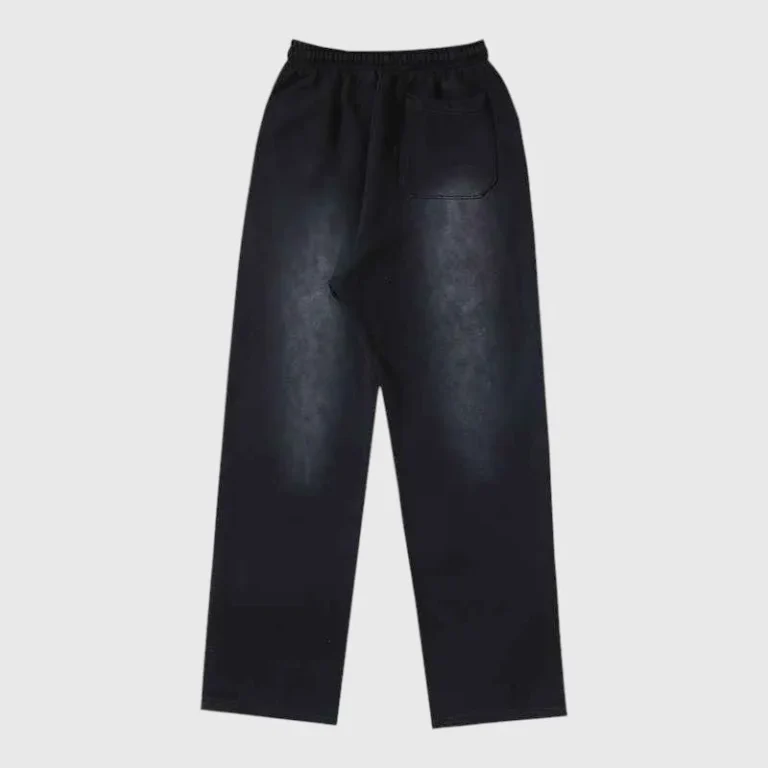 Back view of the Hellstar Red Flame sweatpants featuring a vintage washed black fabric and a relaxed fit.