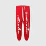 Bright red Hellstar print logo sweatpants featuring a drawstring waist and white graphic branding on the front legs.