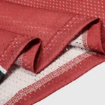 Close-up detail of the breathable red mesh fabric used in the Hellstar Sports Long Sleeve graphic tee for men.