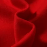 Close-up view of the premium red fabric used in the Hellstar Print Logo Sweatpants, showcasing soft texture.